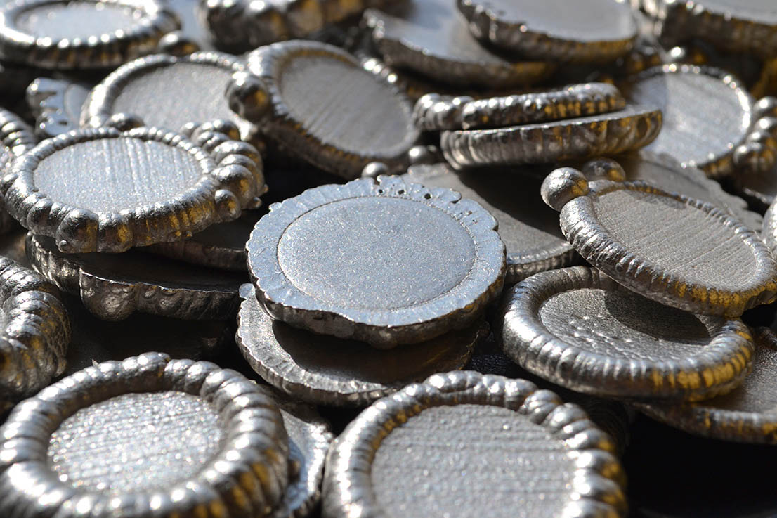 Round zinc ball anodes used in galvanizing and electroplating processes.